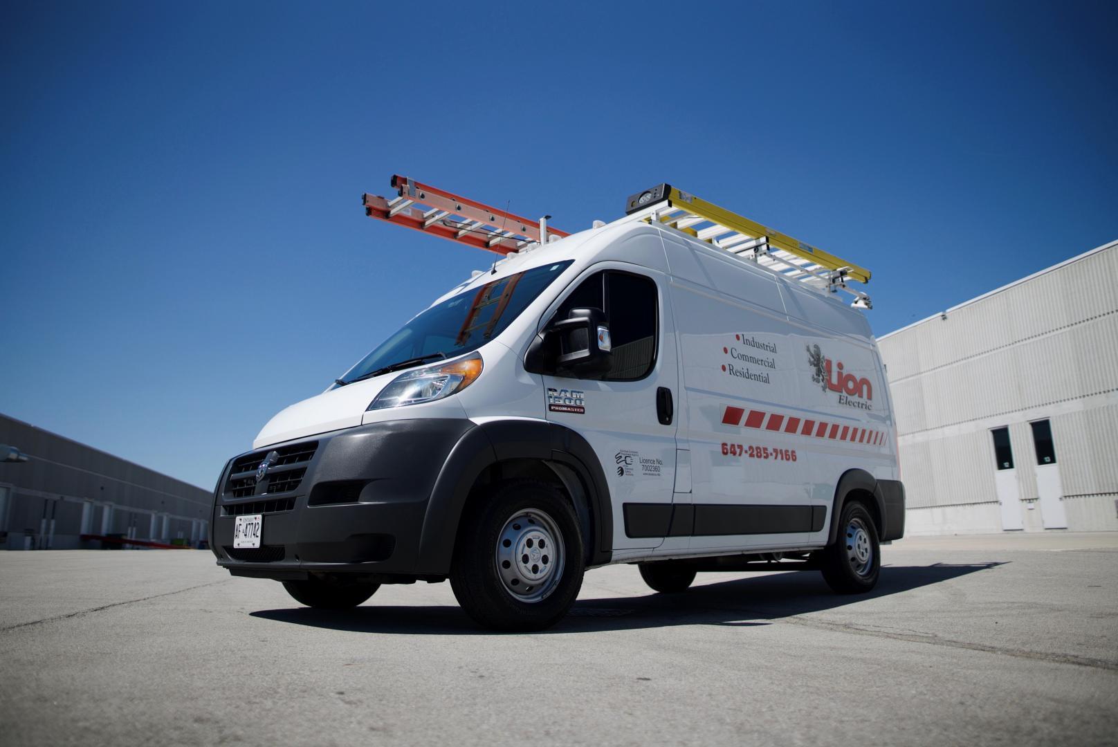 Lion Electric service van — installation crew on site
